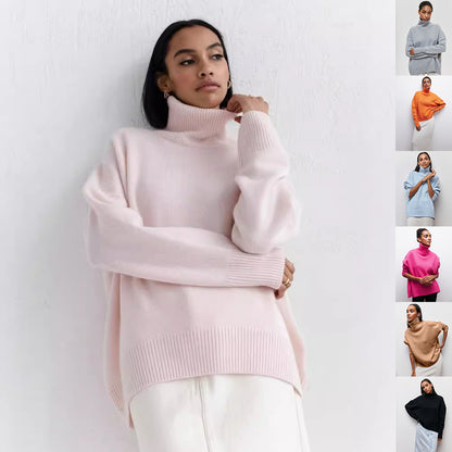 Woman wearing a light pink turtleneck sweater against a white background